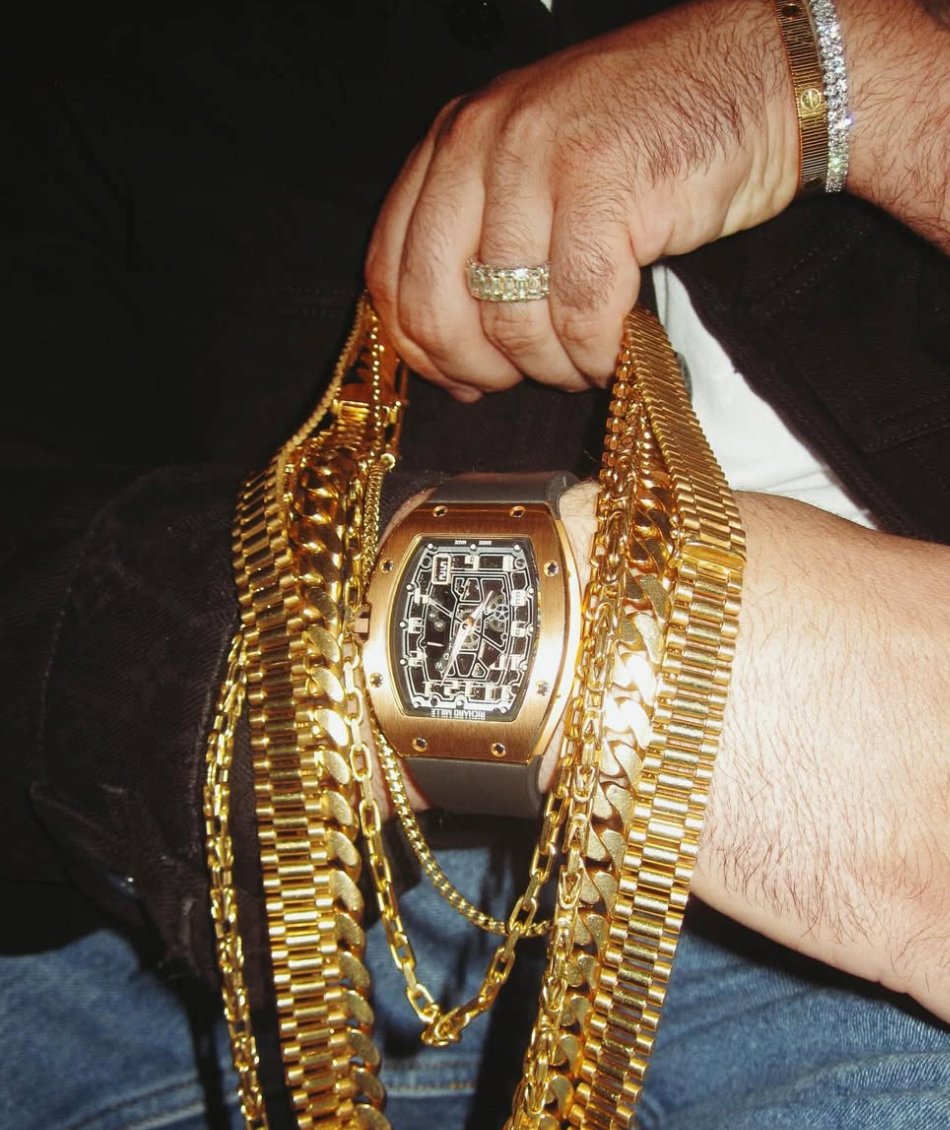Gold chains and Richard Mille watch